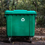 Large,Green,Recycle,Bin,On,The,Street,Of,A,Park