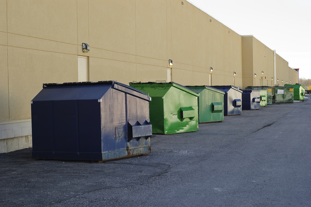 Blue,And,Green,Industrial,Garbage,Bins,Lined,Up,Outside,Along