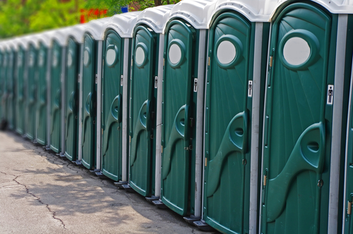 Row,Of,Outhouses,Or,Porta,Potties,Waiting,To,Be,Used