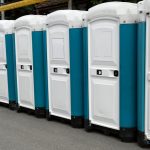 Row,Of,Portable,Toilets,At,An,Outdoor,Event